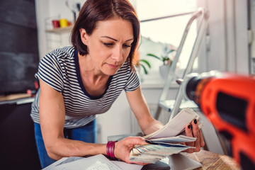 Woman checking color swatch