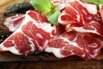 Italian sliced cured coppa with spices. Raw ham. Crudo or jamon