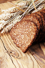 bread on wooden board from above. Kitchen or bakery poster design.