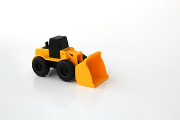 Fototapeta premium A Toy wheel loader on an isolated white background 2