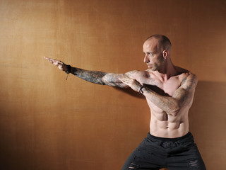 Young bodybuilder showing his physiognomy.