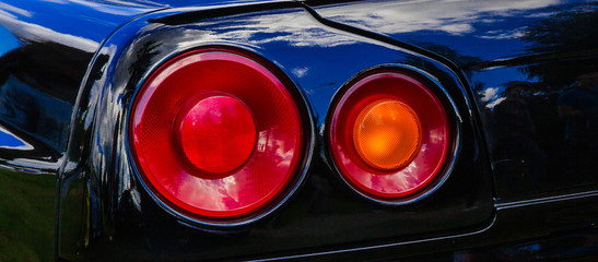 The tail light of the black car.