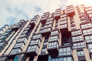 New multi-storey residential building. Modern house on sky background