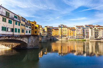 Fototapeta na wymiar View of medieval stone bridge Ponte Vecchio and the Arno River in Florence, Tuscany, Italy