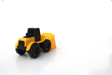 A Toy wheel loader on an isolated white background 10