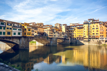 Fototapeta na wymiar View of medieval stone bridge Ponte Vecchio and the Arno River in Florence, Tuscany, Italy
