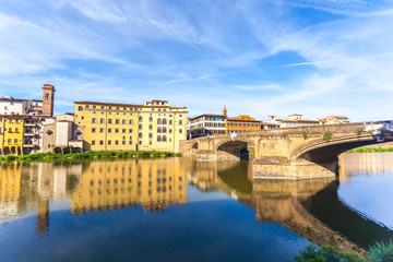 Obraz premium Colorful old buildings line the Arno River in Florence, Italy