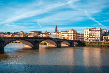 Naklejka premium Colorful old buildings line the Arno River in Florence, Italy