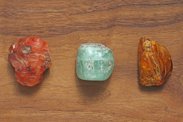 Carnelian, Beryl, Emerald, Amber. Collection of natural stones of minerals on a background of...