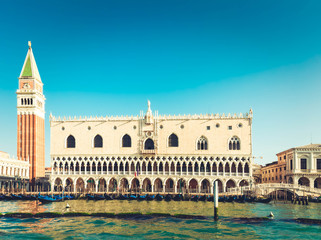 Fototapeta na wymiar San Marco belltower and Doge palace at summer day, Venice, Italy, toned