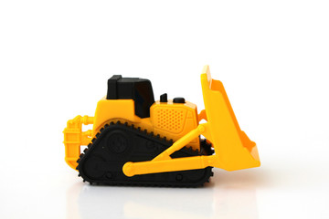 A Toy bulldozer on an isolated white background 7