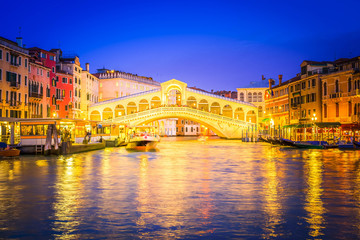 view of famouse Rialto bridge at night, Venice, Italy, toned