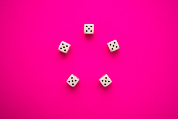 dice on a magenta background