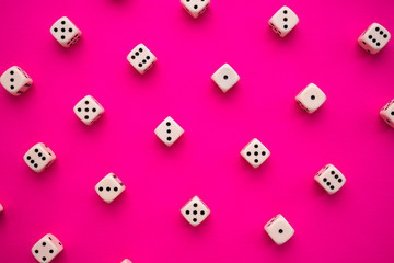 dice on a magenta background