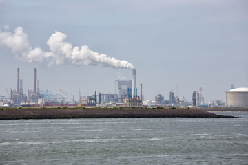 Obraz premium Cranes and power plant in Harbor of Rotterdam, biggest seaport of Europe