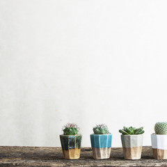 Stylish and modern scandinavian room with wooden console, mock up poster frame and beautiful plants. Design composition of home interior.