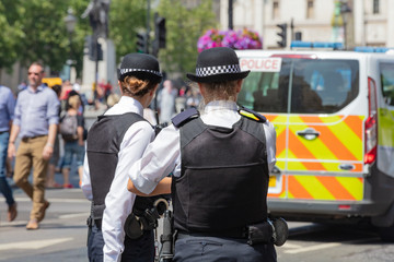 London, England, UK; 13th July 2018; Rear view of Two Female Metropolitan Police Officers in the...