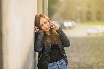 Fototapeta premium Pretty girl listening music with her headphones