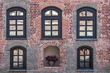 Brick wall with windows.