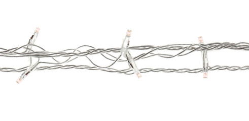 Christmas lights on white background, top view