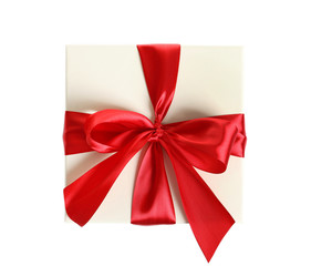 Gift box with ribbon on white background, top view