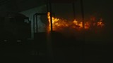 Slow motion of fire being extinguished with water