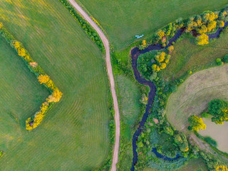 aerial top view  on field meadow and river