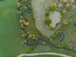 aerial top view  on field meadow and river