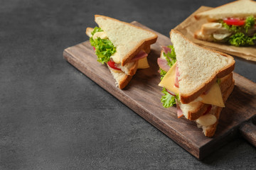 Tasty toast sandwiches on table. Wheat bread