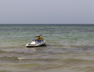 Fototapeta na wymiar Scooter on the background of the sea