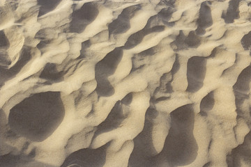 Sea sand lies in waves