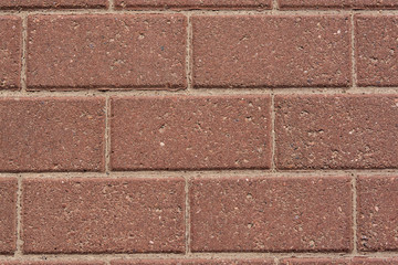 Wall of red granite bricks