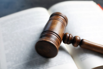 Wooden gavel and book, closeup. Law concept