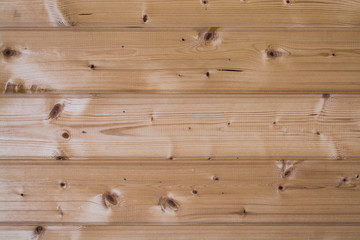 The natural color of unpainted wooden boards