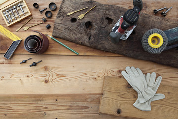 top view of power tools for woodworking on wooden rustic boards