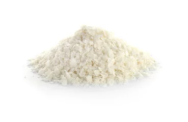 Schilderijen op glas Raw rice flakes on white background. Healthy grains and cereals © New Africa