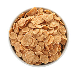 Bowl with wheat flakes on white background. Healthy grains and cereals