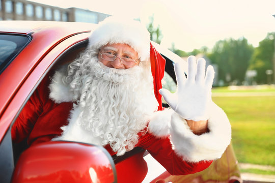Authentic Santa Claus in car, view from outside