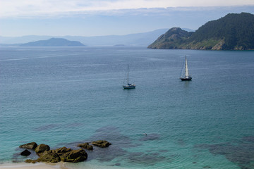 Sailboats anchoring on the coast of the Cíes Islands