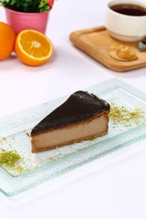 Slice of chocolate cheesecake and coffee