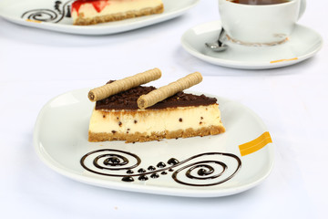 Slice of chocolate cheesecake and coffee