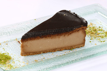 Slice of chocolate cheesecake and coffee