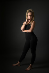 Fototapeta na wymiar Blonde young woman dancing dancehall