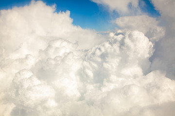 Clouds that are visible from the airplane window. Flight in the clouds or over the clouds