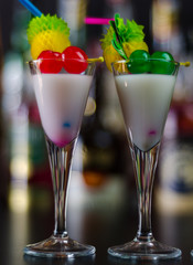 exotic drink based on Malibu rum and other ingredients, cocktail prepared by the bartender