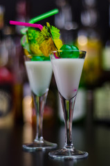 exotic drink based on Malibu rum and other ingredients, cocktail prepared by the bartender