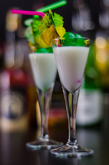 exotic drink based on Malibu rum and other ingredients, cocktail prepared by the bartender