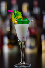 exotic drink based on Malibu rum and other ingredients, cocktail prepared by the bartender