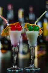 exotic drink based on Malibu rum and other ingredients, cocktail prepared by the bartender