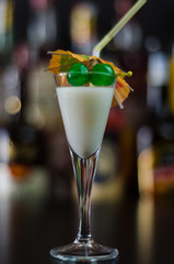 exotic drink based on Malibu rum and other ingredients, cocktail prepared by the bartender